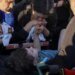 Выжили вопреки аду: мать держит за руку 6-летнего сына, которого достали из-под завалов во Львове. ВИДЕО